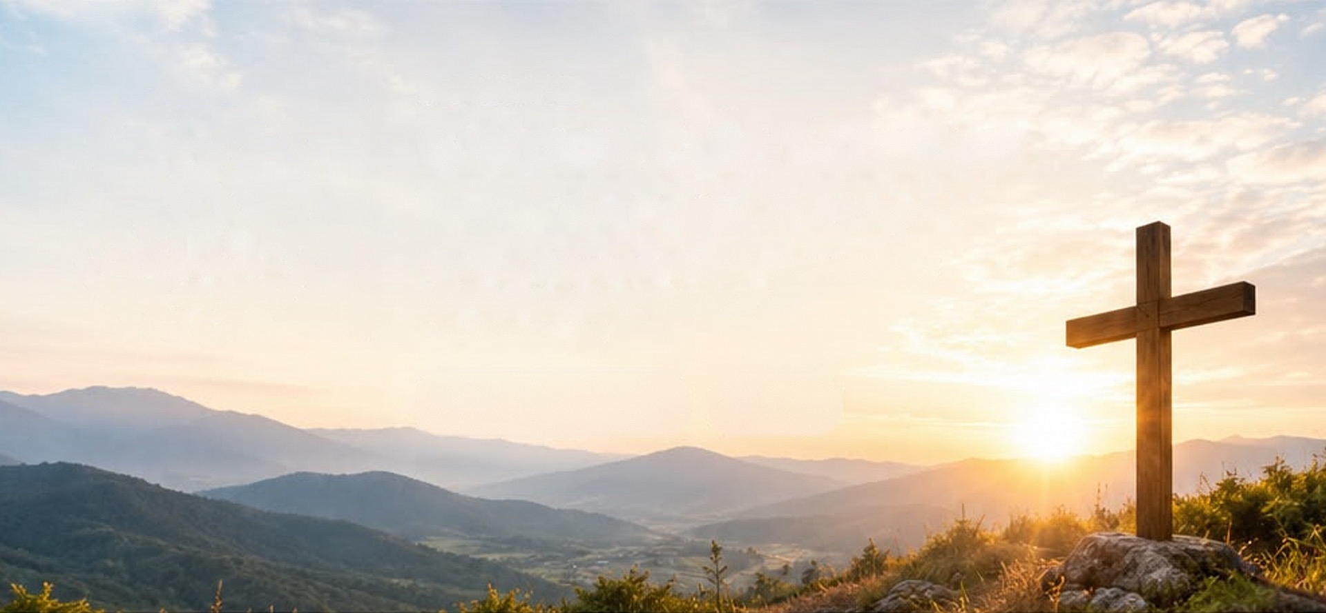 Cross on a hill at golden sunset